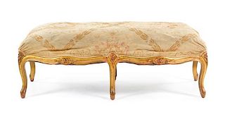 A Louis XV Style Giltwood Bench Height 17 1/2 x width 48 x depth 22 1/2 inches.