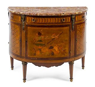 A Louis XVI Style Marquetry Commode Height 36 x width 43 1/2 x depth 17 1/4 inches.