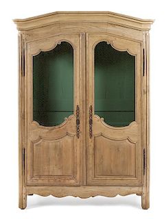 A Louis XVI Style Limed Wood Armoire Height 89 1/ 4 x width 61 x depth 16 3/4 inches.