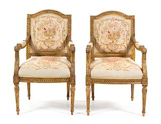 A Pair of Louis XVI Style Giltwood Fauteuils Height 41 inches.