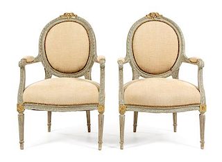A Pair of Louis XVI Style Painted and Parcel Gilt Fauteuils Height 37 inches.