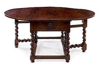 A French Walnut Gate-Leg Table Height 30 1/2 x width 52 1/4 x depth 30 1/4 inches (closed).