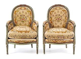 A Pair of Louis XVI Style Painted and Parcel Gilt Bergeres Height 37 1/4 inches.