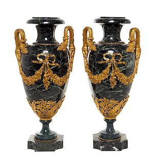 A Pair of French Gilt Bronze Mounted Marble Urns Height 25 x width 12 inches.