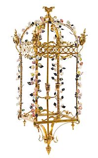 A French Porcelain Mounted Gilt Metal Lantern Height 47 /2 x width 18 x depth 18 inches.