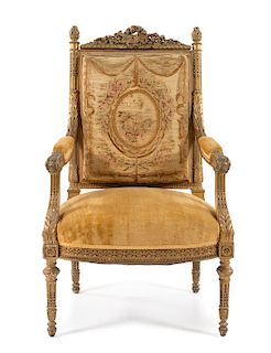 A Louis XVI Style Giltwood Fauteuil Height 42 inches.