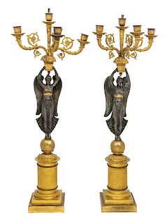 A Pair of Empire Style Gilt and Patinated Metal Figural Five-Light Candelabra Height 29 1/4 inches.