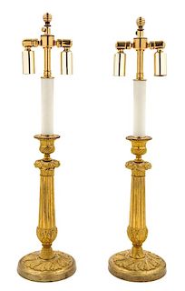 A Pair of Empire Gilt Bronze Candlesticks Height 21 inches.