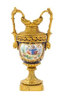 A Sevres Style Gilt Bronze Mounted Porcelain Urn Height 8 inches.