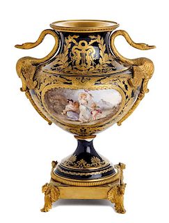 * A Sevres Style Gilt Bronze Mounted Porcelain Urn Height 12 3/8 inches.