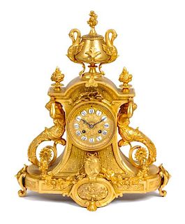 A Napoleon III Style Gilt Bronze Clock Garniture Height 20 inches.