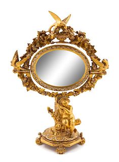 * A Continental Giltwood Dressing Mirror Height 28 inches.