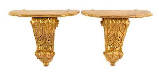 * A Pair of Italian Giltwood Wall Brackets Height 21 x width 24 1/4 x depth 11 5/8 inches.