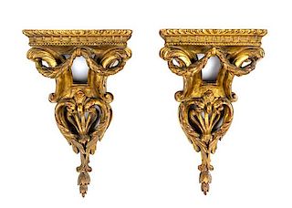 * A Pair of Italian Giltwood Wall Brackets Height 14 inches.