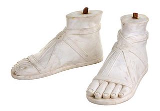 A Pair of Italian Carved Marble Feet Height 7 7/8 x width 5 1/2 x depth 15 1/4 inches.