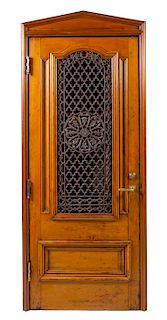 A Continental Walnut and Iron Confessional Booth Height 85 3/4 x width 36 x depth 24 3/4 inches.