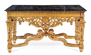 An Italian Carved Wood Center Table Height 36 x width 64 x depth 24 1/4 inches.