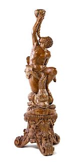 An Italian Carved and Painted Figural Wood Pedestal Height overall 59 inches.