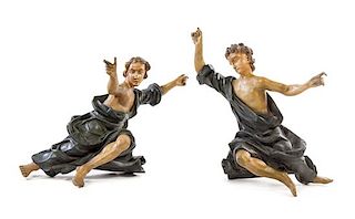 A Pair of Continental Carved and Polychrome Painted Ecclesiastical Figures Height 49 x width of wider 34 1/2 inches.