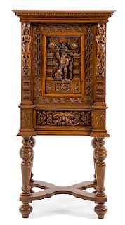 * A Dutch Carved Oak Cabinet Height 56 inches.