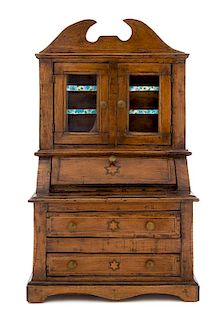 * A Continental Diminutive Fruitwood Secretary Bookcase Height 17 1/4 inches.