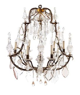 A Continental Six-Light Chandelier Height 36 inches.