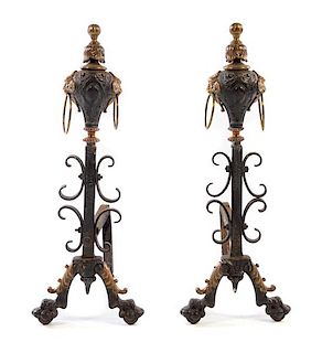 A Pair of Continental Iron Andirons Height 29 inches.