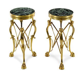 A Pair of Neoclassical Style Gilt Bronze Gueridons Height 26 3/4 x diameter of top 12 5/8 inches.