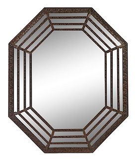 A Dutch Baroque Style Pressed Brass Mirror Height 60 x width 49 1/2 inches.