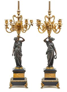 * A Pair of Continental Gilt and Patinated Bronze Figural Candelabra Height 42 1/2 inches.