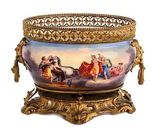 * A Continental Gilt Metal Mounted Ceramic Jardiniere Width 13 inches.