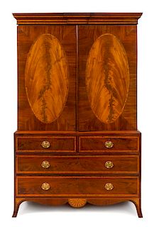 * A Regency Style Mahogany Linen Press Height 86 x width 53 3/4 x depth 23 inches.