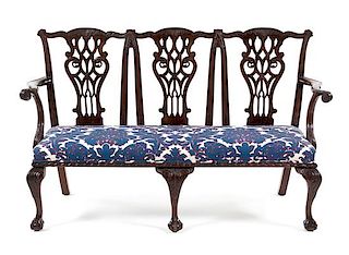 A Chippendale Style Mahogany Triple Back Settee Height 38 1/2 x width 62 inches x depth 21 1/2 inches.