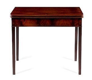 A George III Mahogany Flip-Top Game Table Height 29 x width 35 1/2 x depth 17 3/4 inches.