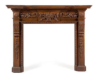A Neoclassical Carved and Stained Pine Mantel Height 54 x width 68 1/2 x depth 9 inches.