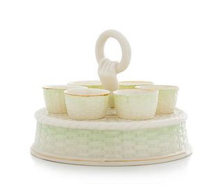 * A Belleek Egg Caddy with Cups Diameter 6 3/4 inches.