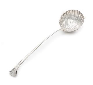 A George III Silver Ladle, Possibly John Innocent, London, 1762, having a shell form bowl, the handle with a volute terminal.