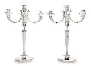 A Pair of French Silver Three-Light Candelabra, Maker's Mark CBA, 19th Century, the stem of faceted tapering form issuing two sc