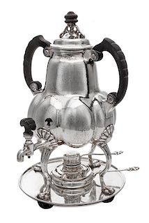 * A German Silver Kettle on Lampstand, Bremer Werkstatten fur Kunstgewerbliche Silberarbeiten, Early 20th Century, having an ebo