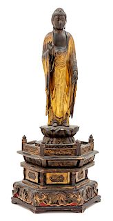 * A Gilt Lacquered Wood Figure of Buddha Height overall 33 1/2 inches.