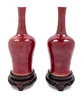 A Pair of Chinese Sang de Boeuf Porcelain Vases Height of porcelain 9 1/8 inches.