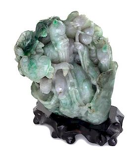 A Burmese Carved Jade Figural Group Height 5 1/4 inches.