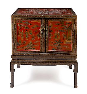 * A Chinese Export Lacquered Cabinet on Stand Height 39 1/2 x width 34 x depth 22 inches.