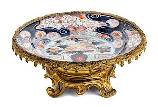 * A Gilt Metal Mounted Imari Palette Porcelain Charger Width 14 1/2 inches.