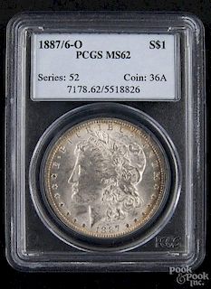 Silver Morgan dollar coin, 1887/ 6 O, PCGS MS-62.