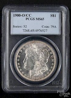 Silver Morgan dollar coin, 1900 O/CC, PCGS MS-65.