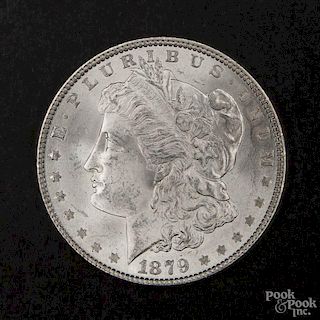 Silver Morgan dollar coin, 1879, MS-62 to MS-63.