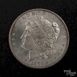Silver Morgan dollar coin, 1879 O, MS-63 to MS-64.