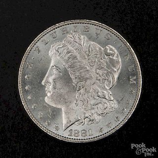 Silver Morgan dollar coin, 1881, MS-62 to MS-63.