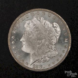 Silver Morgan dollar coin, 1881 CC, MS-64 to MS-65.